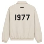 Fear of God Essentials 1977 Jacket Eggshell Off-White Back View – Flocked 1977 Logo