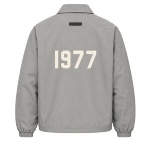 Fear of God Essentials 1977 Nylon Coaches Jacket Grey Back View – Flocked 1977 Logo